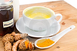 Turmeric roots with milk and honey drinks for beauty and health.