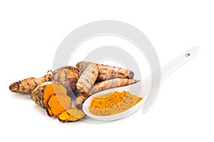 Turmeric roots and powder, healthy food with healing properties.