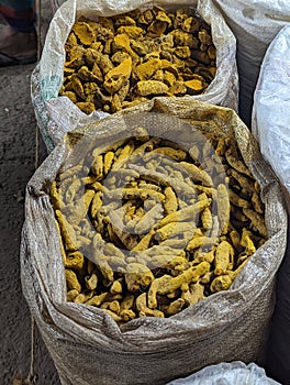 Turmeric Roots or sticks are displayed in a bazaar or in a street market stall