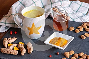 Turmeric tea or golden milk has been venerated since ancient times for its healing properties photo