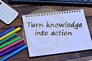 Turn knowledge into action words on notebook