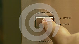 Turn on or off a av receiver , close up