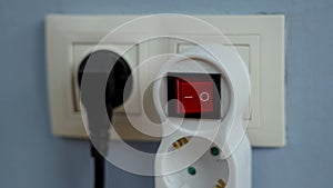 Turn off the electricity supply by pressing the red push button switch