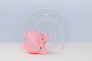 Turn over pink piggy bank, copy space. Financial crisis. Decrease in income. Insufficient funds. Default, lack of money