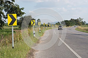 Turn right road sign on country road.