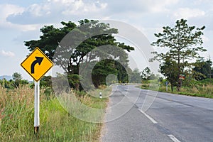 Turn right road sign on country road.