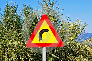 Turn right road sign hit by bullets