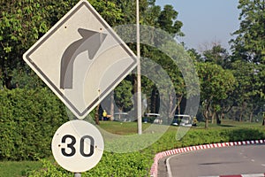 Turn Right Sign with 30km/h speed limit sign