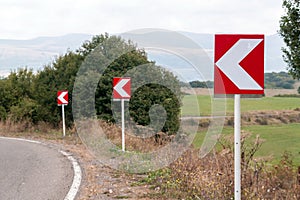 Turn signs on mountain road