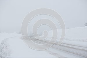 Turn on a snowy road. Snowfall and large snowdrifts