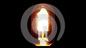 Turn on and turn off in slow motion, retro vintage light bulb with old technology with filament built-in with warm light yellow