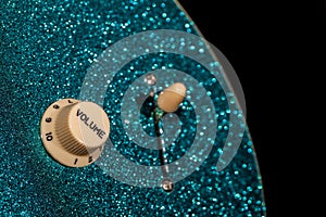 Turn up the volume. Control knob from a sparkly glam rock guitar