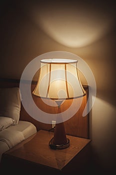 Turned On Old Lamp near the wall