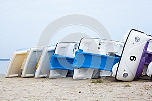 Turned over catamarans on the beach