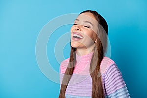 Turned photo of positive cute pretty girl laughing wear pullover isolated over blue color background