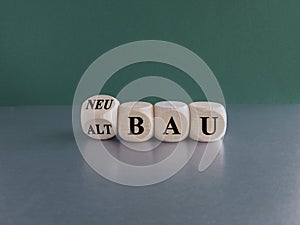 Turned a wooden cube and changes the German word Altbau (old construction in English) to Neubau