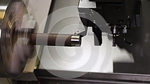 Turning bench lathe machine milling a metal rod