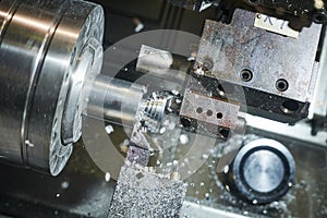 Turning cnc machine at metal work industry. Multitool precision manufacturing and machining