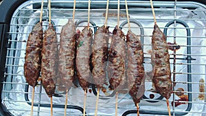 Turning cutlets on an electric grill