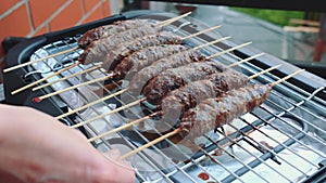 Turning cutlets on an electric grill