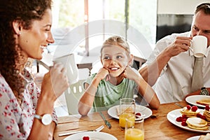 Turning mealtime into quality time. a family having breakfast together at home.