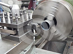 Turning part by manual lathe machine