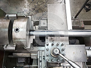 Turning part by manual lathe machine