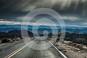 Turning Sign on a Desert Road