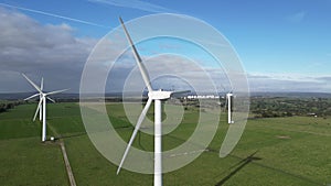 Turning wind turbines out in the green open field Harrogate North Yorkshire England UK