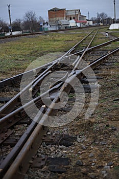 turnout railroad tracks of the old model near grass and earth. for introductory instructions books photo