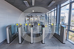 Turnstiles with electronic card readers on the station.