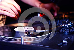 Turntable, hand of dj on the vinyl record