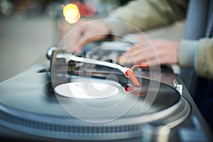 Turntable, hand of dj on the vinyl record