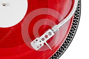 Turntable needle on a red plate