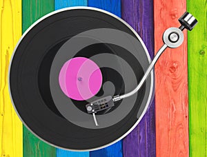 Turntable over colorful wooden planks