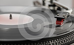 Turntable is playing vinyl LP record