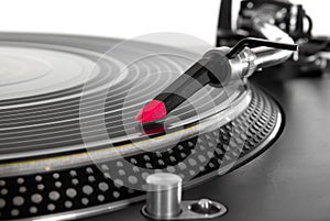 Turntable playing vinyl record photo