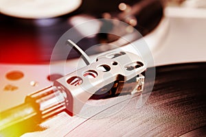 Turntable playing vinyl record with music