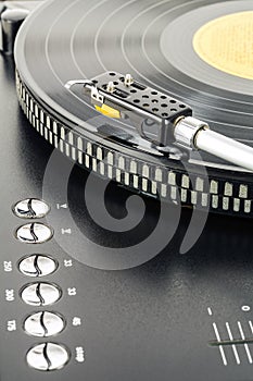 Turntable plays vinyl record