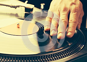 Turntable scratch, hand of dj on the vinyl record