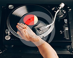 Turntable scratch, hand of dj on the vinyl record