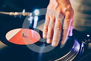 Turntable scratch, hand of dj on the vinyl record