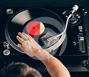 Turntable scratch, hand of dj on the vinyl record
