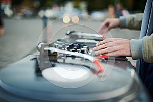 Turntable, hand of dj on the vinyl record