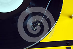 Turntable with vinyl record closeup