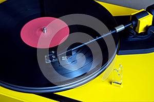 Turntable with vinyl record closeup