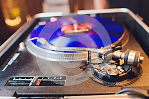 Turntable vinyl record player. Sound technology for DJ to mix play music. Vintage vinyl record player on a background