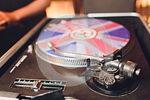 Turntable vinyl record player. Sound technology for DJ to mix play music. Vintage vinyl record player on a background