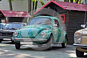 Turqoise or green Volkswagen Beetle photo