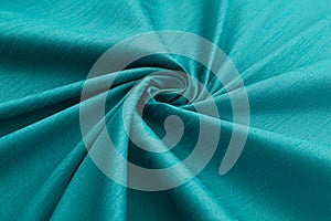 Turquoise background luxury cloth or wavy folds of grunge silk texture satin